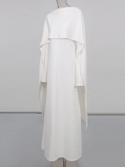 Henny Abaya mit Perlen