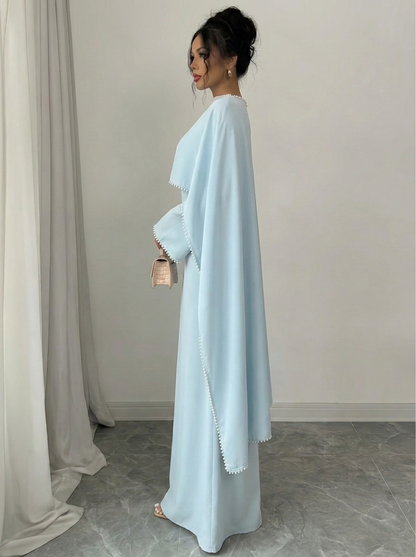 Henny Abaya mit Perlen