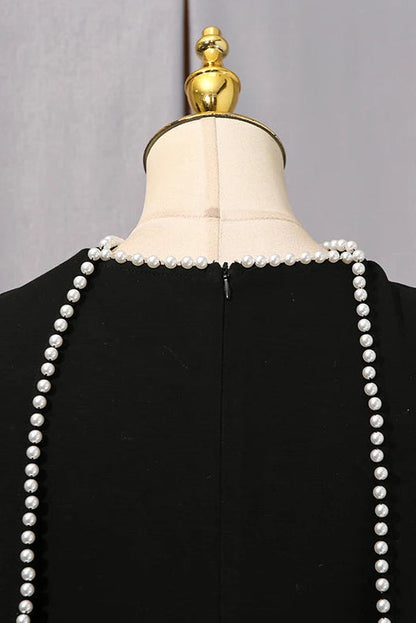 Henny Abaya mit Perlen