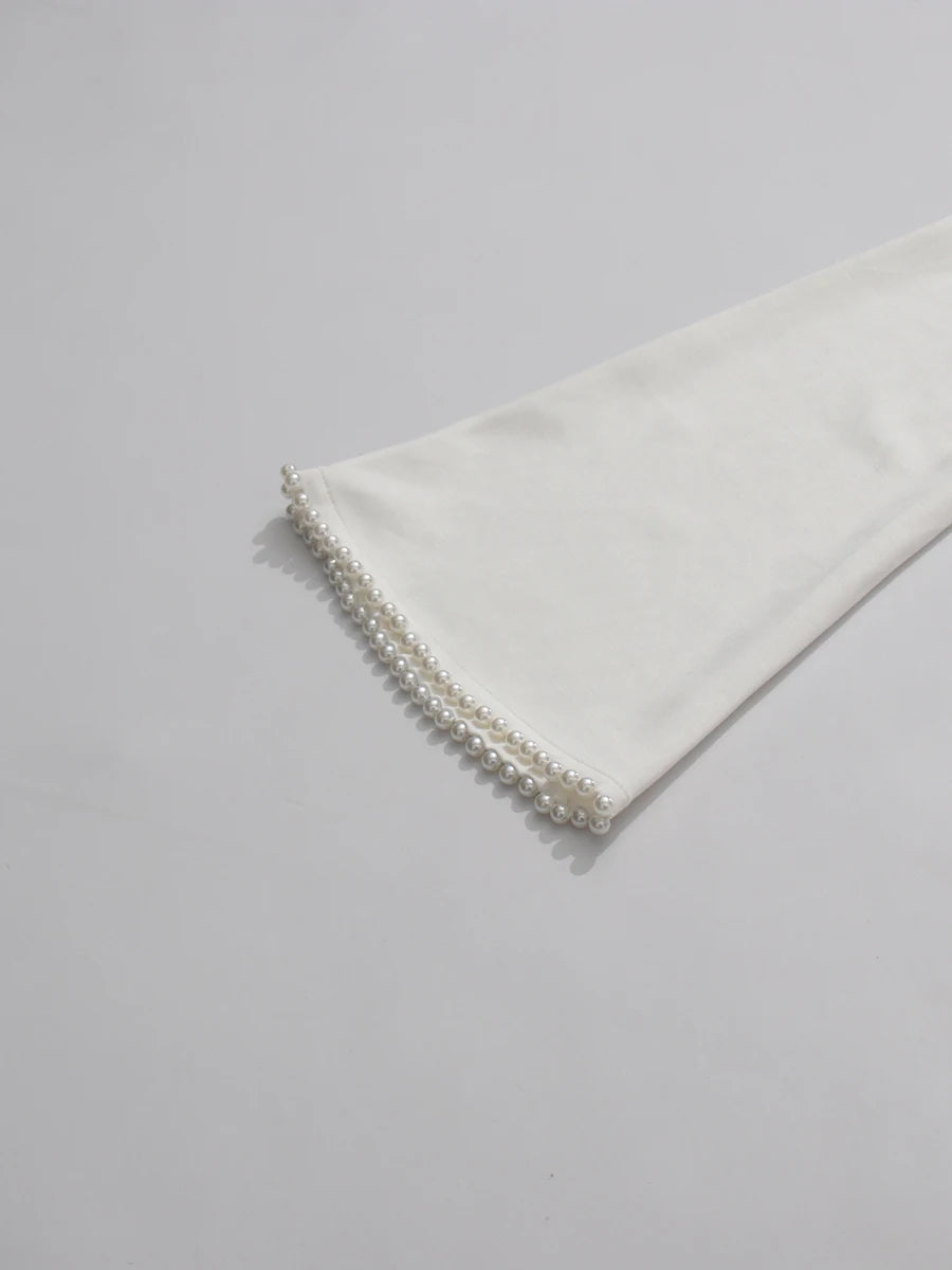 Henny Abaya mit Perlen