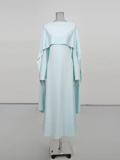 Henny Abaya mit Perlen